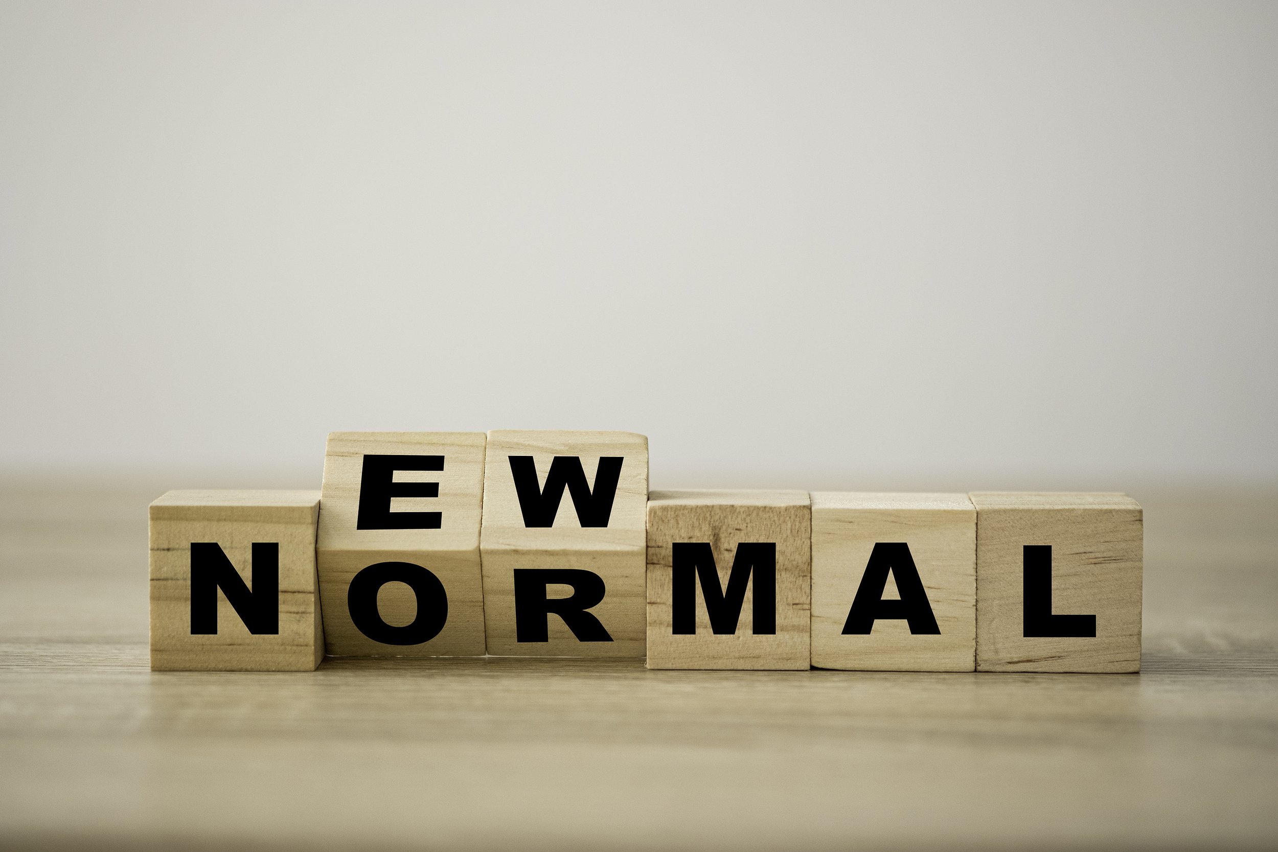 Image of wooden blocks spelling the words new normal.